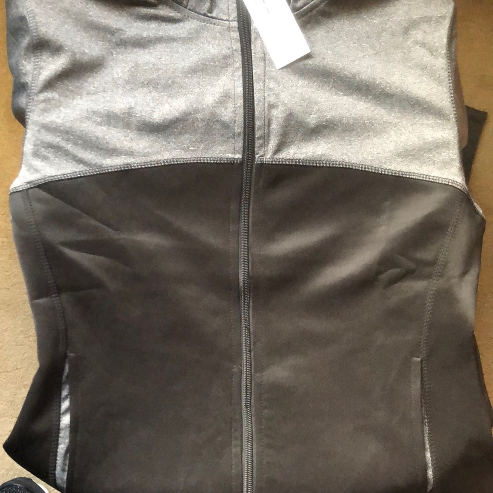 Large black and gray full zip gym jacket.